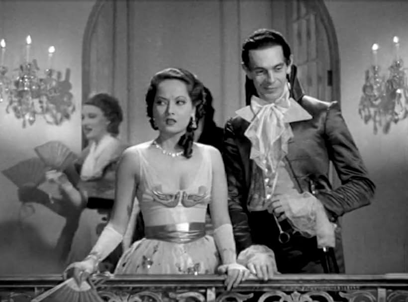 Raymond Massey and Merle Oberon in The Scarlet Pimpernel (1934)