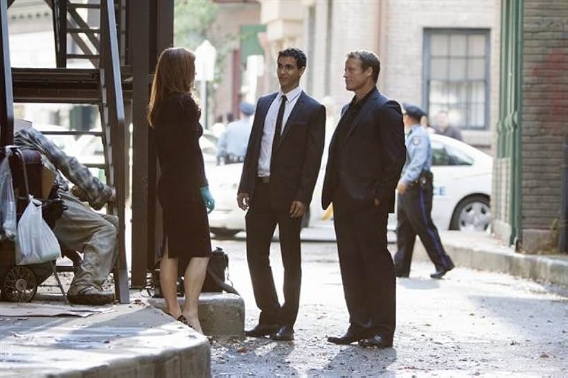 Dana Delany, Mark Valley, and Elyes Gabel in Body of Proof (2011)