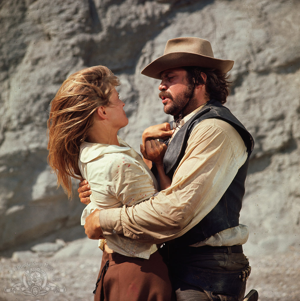 Candice Bergen and Oliver Reed in The Hunting Party (1971)