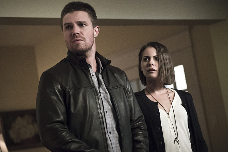 Willa Holland and Stephen Amell in Arrow (2012)