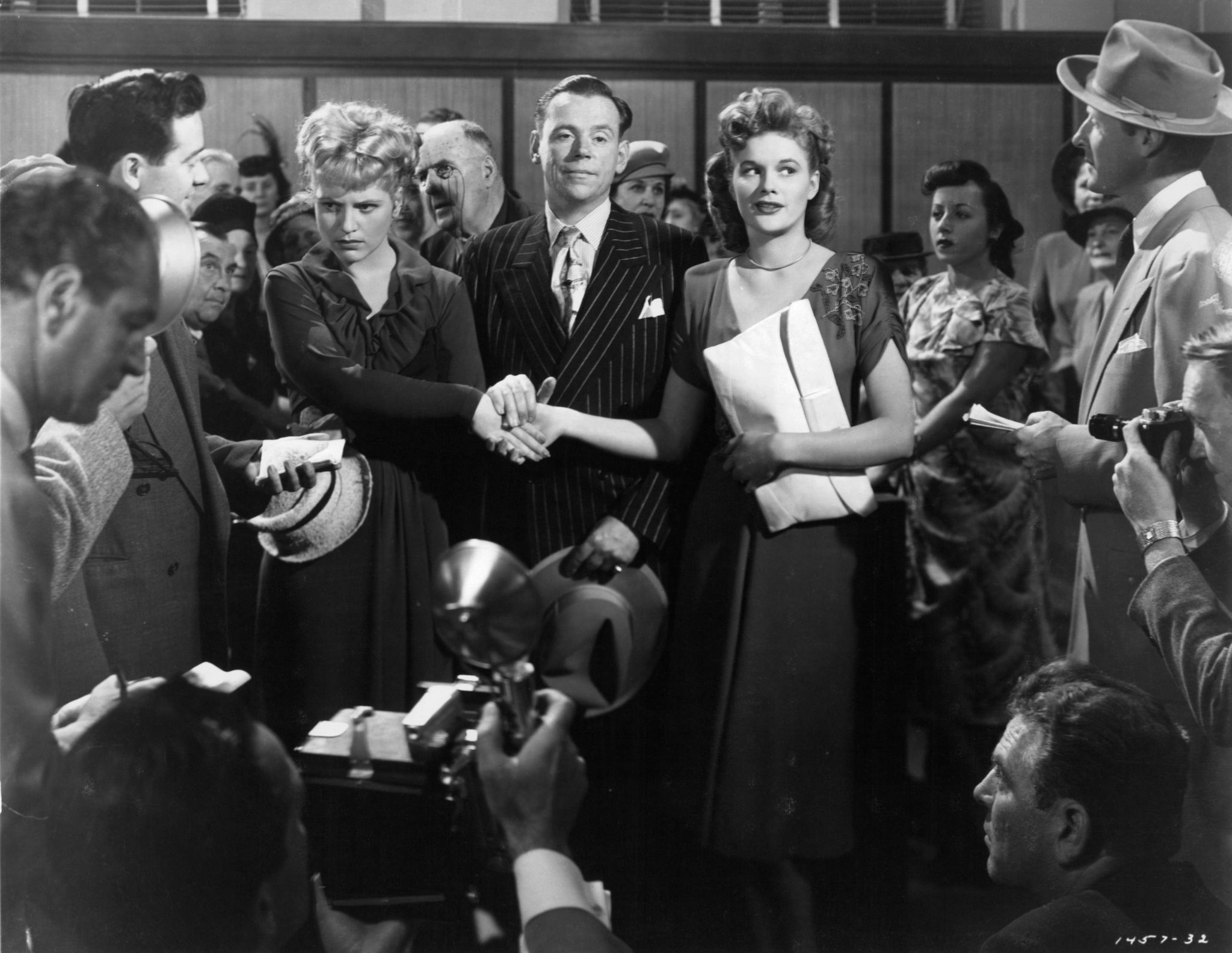 Tom Ewell, Jean Hagen, Judy Holliday, and Michael Kostrick in Adam's Rib (1949)