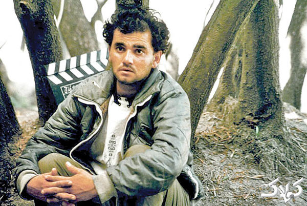 Hossein Rezai in Through the Olive Trees (1994)