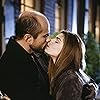 Laura San Giacomo and Enrico Colantoni in Just Shoot Me! (1997)