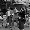 Charles Chaplin, Henry Bergman, and Edna Purviance in The Chaplin Revue (1959)