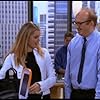 Rebecca Romijn and Brian Posehn in Just Shoot Me! (1997)