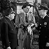 Ronald Reagan, Edward Brophy, and James Gleason in Nine Lives Are Not Enough (1941)