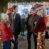 Emily Tennant, Myla Volk, Niall Matter, and Michael Strickland in Holiday Hotline (2023)