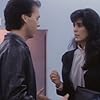 Michael Keaton and Maria Conchita Alonso in Touch and Go (1986)