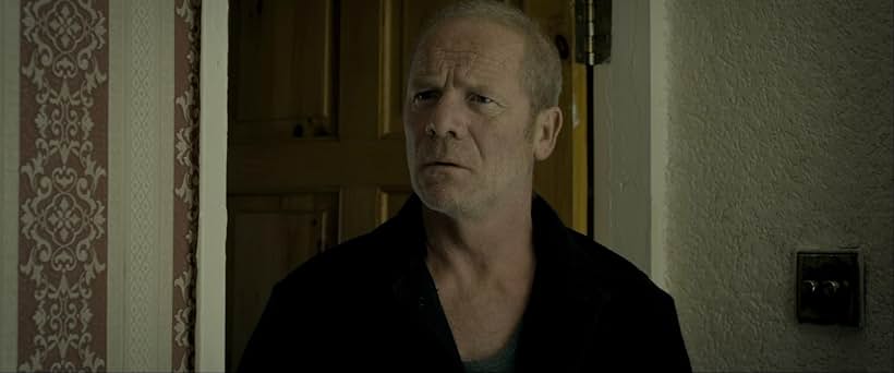 Peter Mullan in Tyrannosaur (2011)