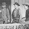 Tim Holt, Lee 'Lasses' White, and Ray Whitley in Thundering Hoofs (1942)