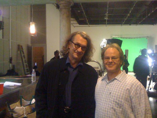 Kaius Harrison with director Wim Wenders between takes during "8" (segment: Person to Person)