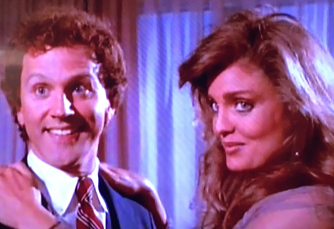 Tracy Scoggins and John Rubinstein in Crazy Like a Fox (1984)