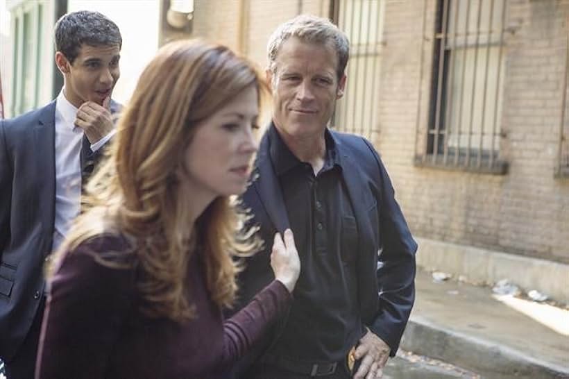 Dana Delany, Mark Valley, and Elyes Gabel in Body of Proof (2011)