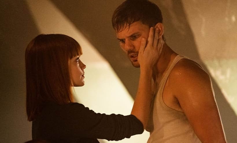 Emilia Schüle and Jeremy Irvine in Treadstone (2019)