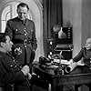 Peter Ustinov, Maurice Buckmaster, and Bernard Lee in Odette (1950)