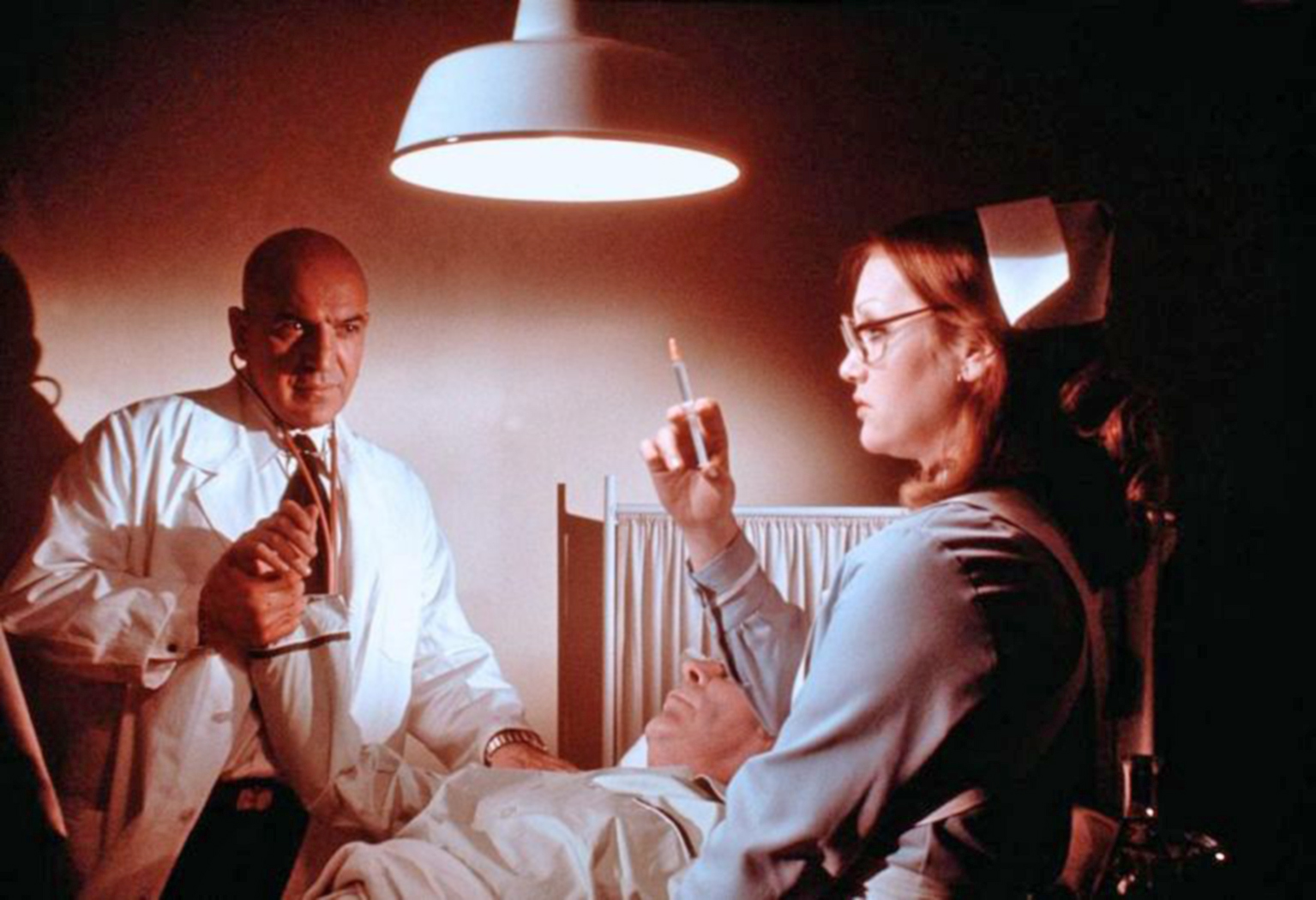 Telly Savalas and Doris Kunstmann in Inside Out (1975)