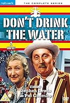 Stephen Lewis and Pat Coombs in Don't Drink the Water (1974)