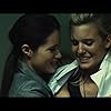 Maggie Grace and Anne-Solenne Hatte in Lockout (2012)