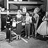 John Agar, June Kenney, Ken Miller, Laurie Mitchell, Scott Peters, and Marlene Willis in Attack of the Puppet People (1958)