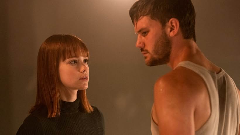 Emilia Schüle and Jeremy Irvine in Treadstone (2019)