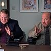 Kyle Gass and Andy Richter in Elf (2003)