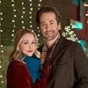 Emily Tennant and Niall Matter in Holiday Hotline (2023)