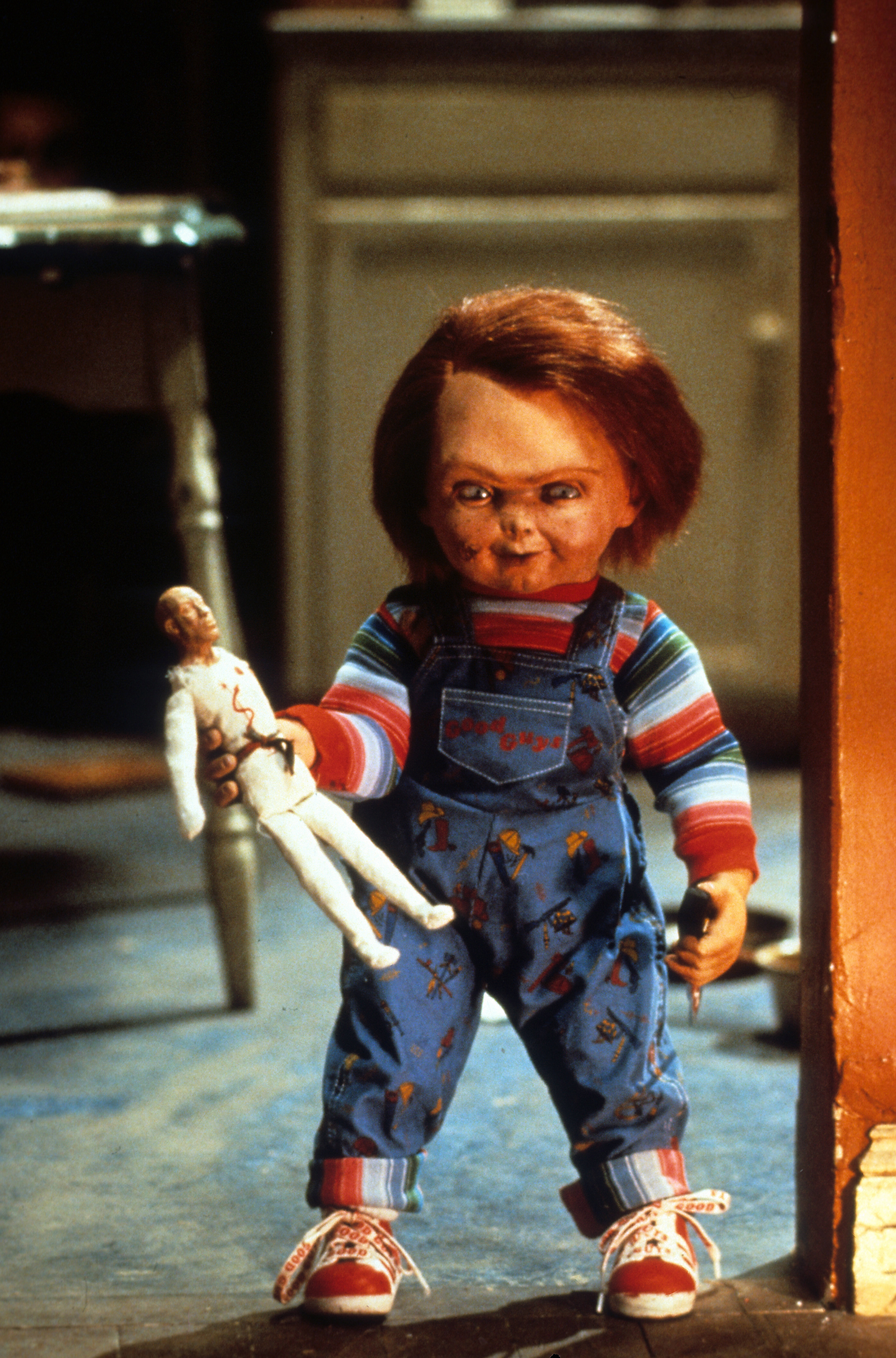 Brad Dourif, Ed Gale, and Hunter Marks in Child's Play (1988)