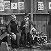 Charles Chaplin, Lloyd Bacon, and Bill Cato in The Champion (1915)