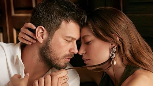 Kivanç Tatlitug and Serenay Sarikaya in The Family (2023)