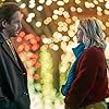 Emily Tennant and Niall Matter in Holiday Hotline (2023)