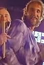 Phil Collins, Mike Rutherford, and Genesis in Genesis: Invisible Touch (1986)