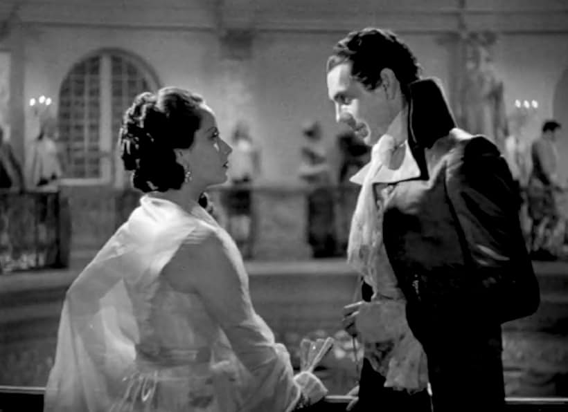 Raymond Massey and Merle Oberon in The Scarlet Pimpernel (1934)