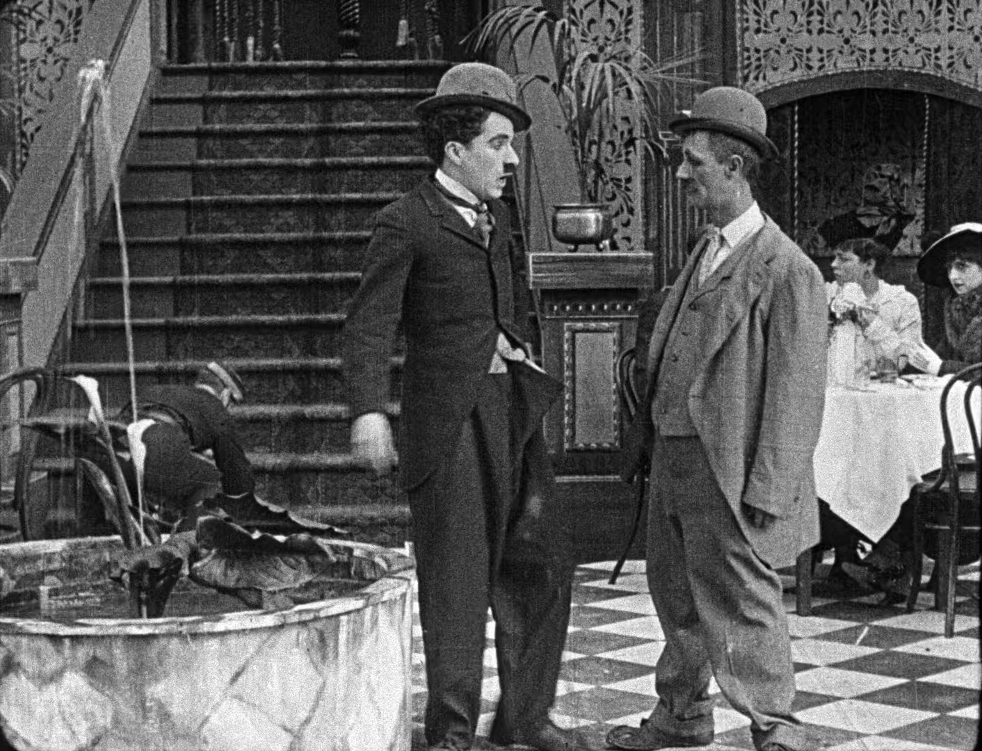 Charles Chaplin, Earl Esola, and Ben Turpin in A Night Out (1915)