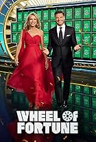 Vanna White and Ryan Seacrest in Wheel of Fortune (1983)