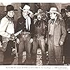 Frank Ellis, Art Fowler, Herman Hack, Edward Howard, Charles King, Dave O'Brien, Tex Ritter, and Jack Hendricks in Three in the Saddle (1945)