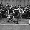 Charles Chaplin, Lloyd Bacon, Bud Jamison, and Ernest Van Pelt in The Champion (1915)