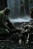 Derek Mears and Crystal Reed in Swamp Thing (2019)