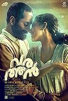 Fahadh Faasil and Aishwarya Lekshmi in Varathan (2018)