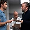 Anupam Kher, Tyler Labine, and Ryan Eggold in In the Graveyard (2020)