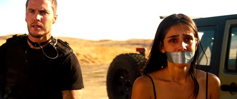 Sandra Echeverría and Taylor Kitsch in Savages (2012)