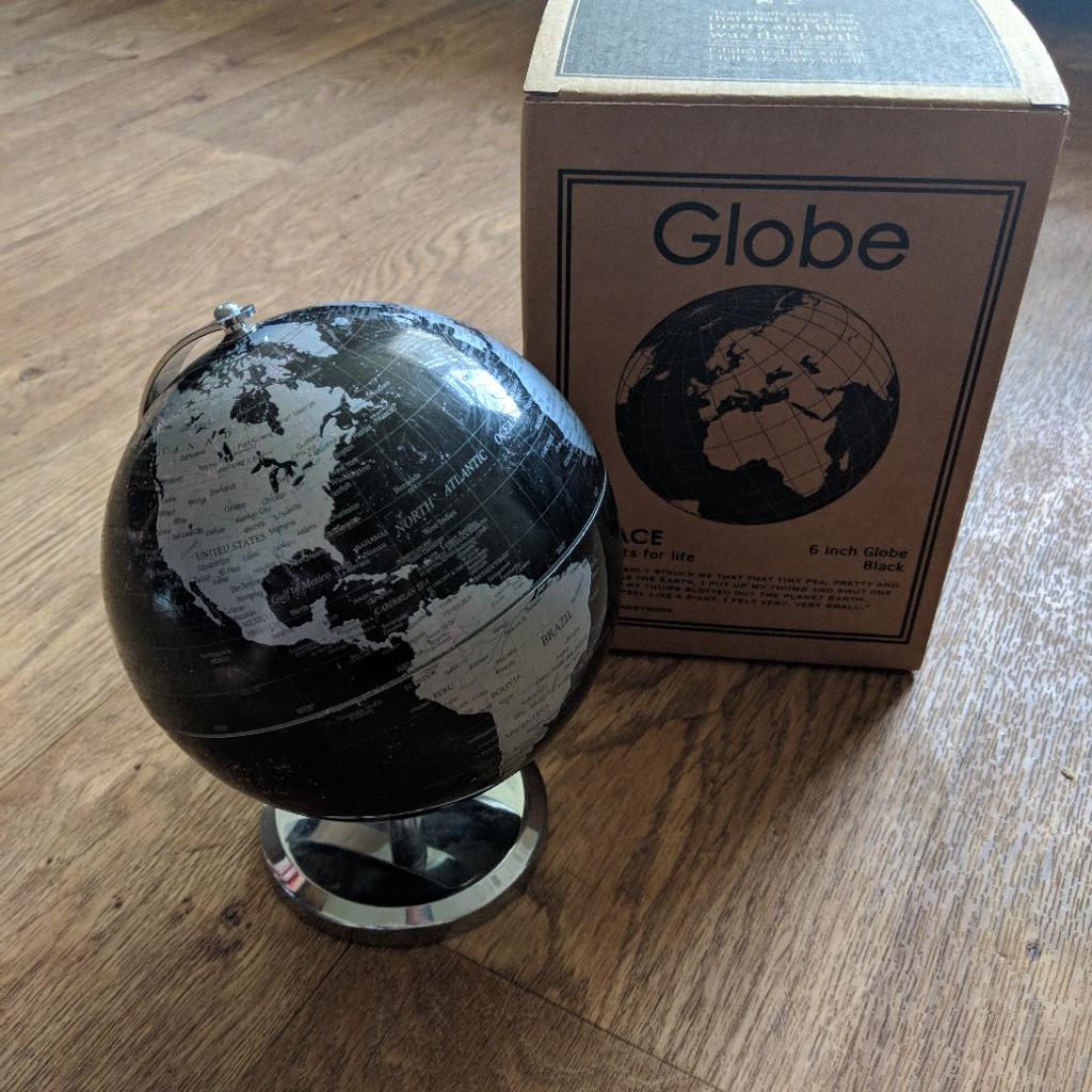 Excellent condition, boxed mini globe in black with a slight glitter coating.