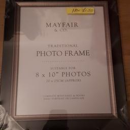 new photo frame suitable for 8x10 photos.black and bronze from smoke and pet free home.collection only