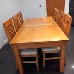 Light Ash Dining Table with 6 matching Chairs with Ivory Faux leather seats. 
Size 6 feet x 39 inches wide. Table has 2 extention lengths first extention extends
by another 39 inches second extention extends to total size 9 feet length. Made by Plum Halo. Nearest price considered.5
Excellent condition.