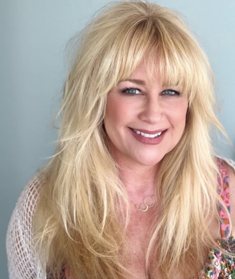 Soft Golden Shag Hairstyles For Women Over 50 With Bangs