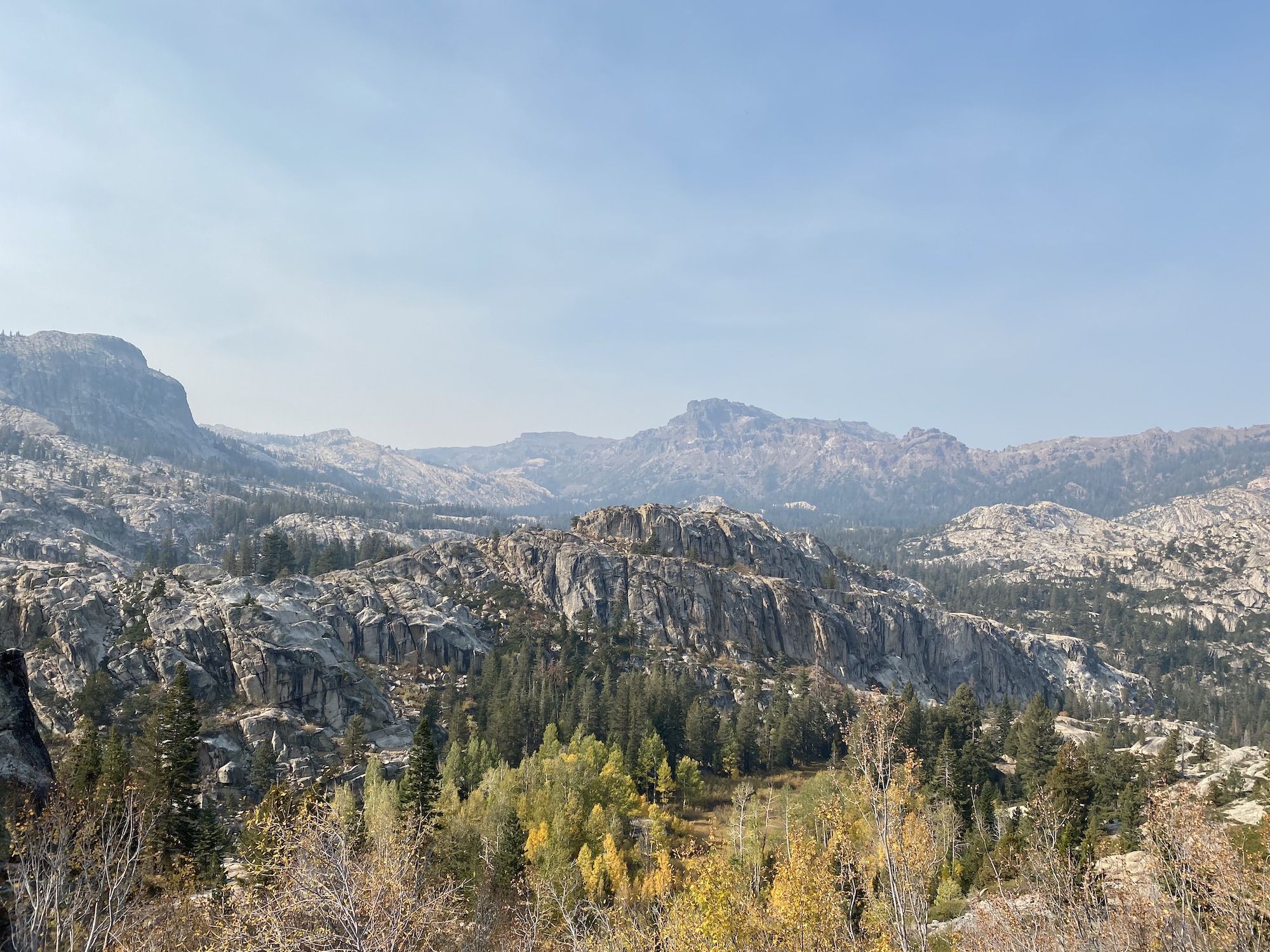 Smoke coming over a mountain crest