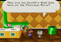 Mario talking to a Toad in the Playroom.