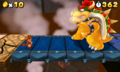 Bowser blocking Mario's path on the bridge.