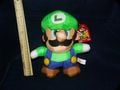 A plushie of Luigi based on Super Mario World