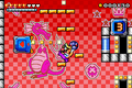 Wario about to throw a Chomp ball into a pinball tulip