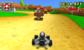 Metal Mario racing past a Goomba.